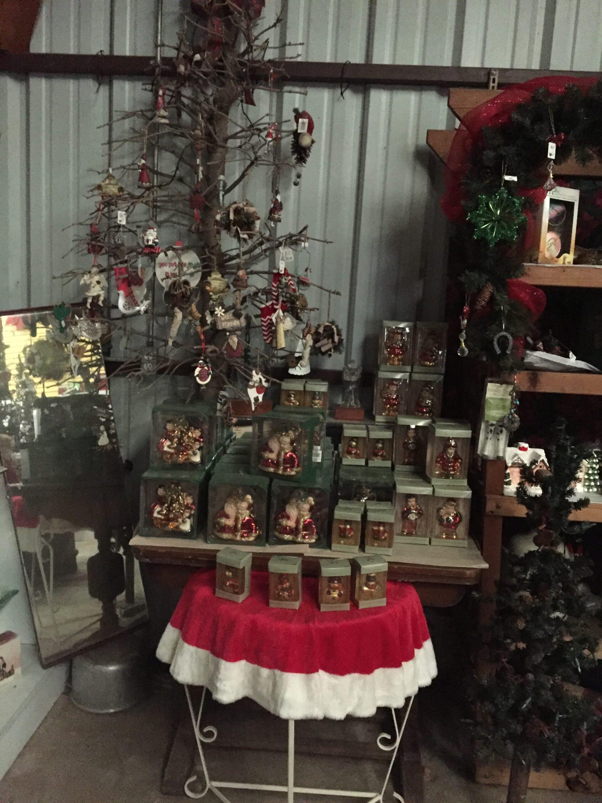 Row of available ornaments, bells, and other Christmas decorations on shelving at Haynie's Green Acres Christmas Tree farm.