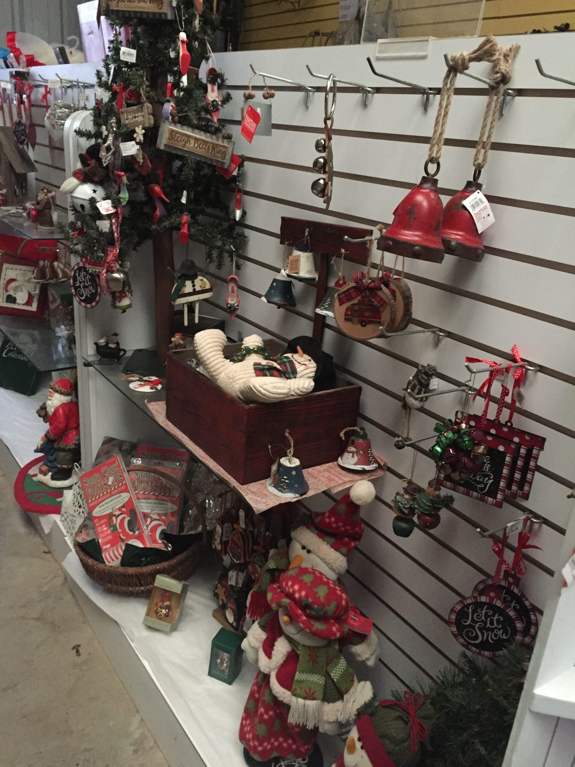 Row of available ornaments, bells, and other Christmas decorations on shelving at Haynie's Green Acres Christmas Tree farm.